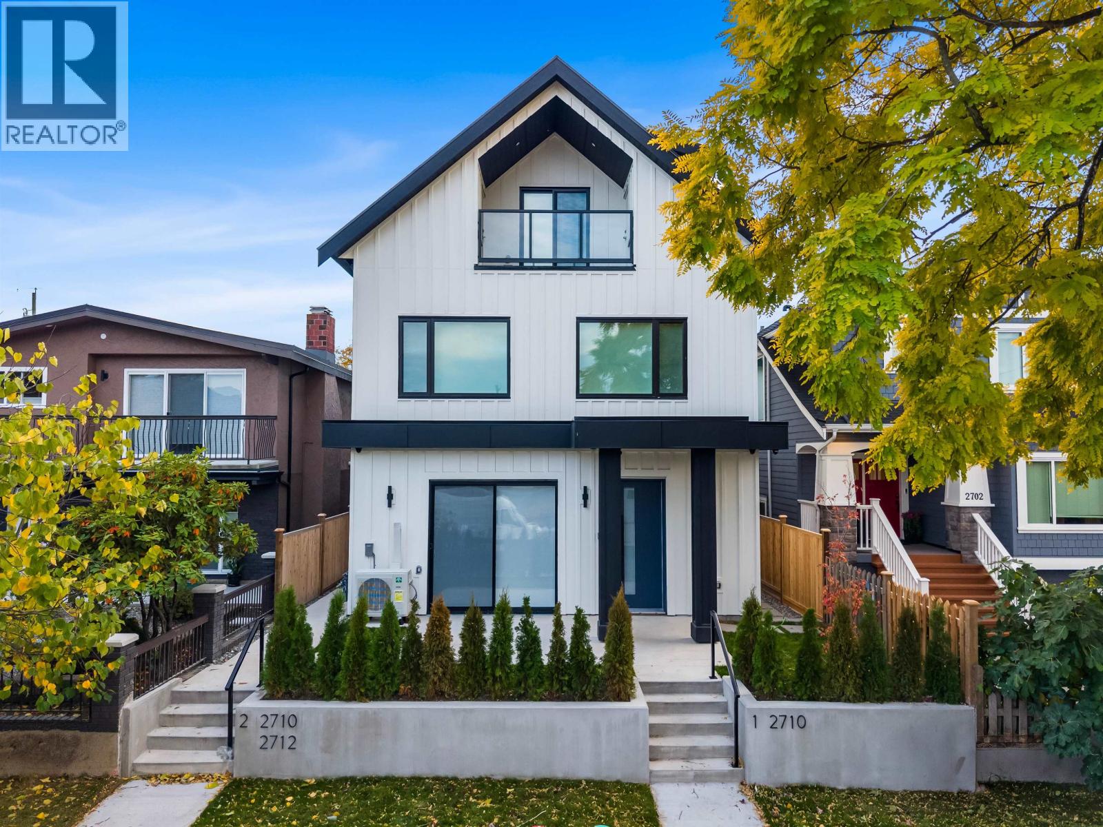 2-2710 Kitchener Street — the front duplex, white siding and dark gable roof